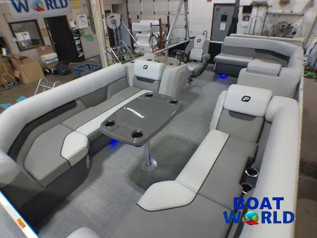 Slide: The Image of 2025 Princecraft Vectra 21 Cruise Lounge interior with gray seating and table, showcased at Boat World. - 30