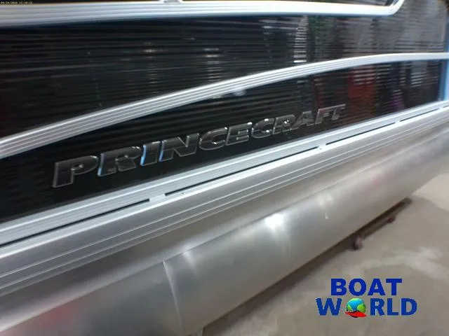 Slide: The Image of 2025 Princecraft Vectra 21 Cruise Lounge boat, close-up view with logo and metallic finish. - 34