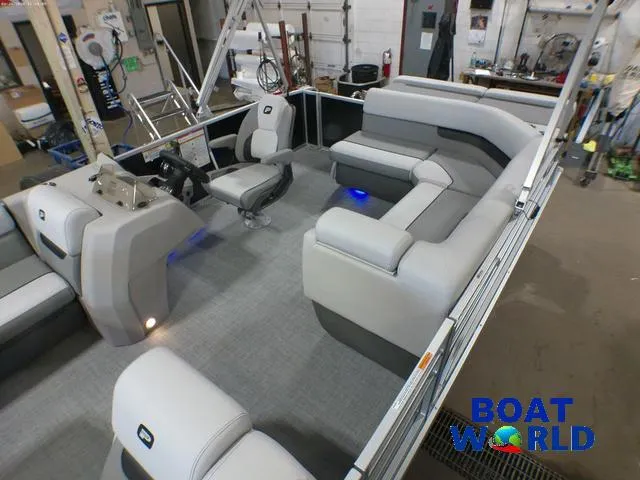 Slide: The Image of 2025 Princecraft Vectra 21 Cruise Lounge interior with modern seating and controls, showcased at Boat World. - 4