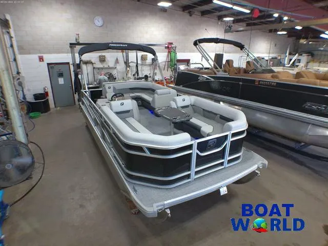 Slide: The Image of 2025 Princecraft Vectra 21 Cruise Lounge pontoon boat in showroom, featuring Mercury 4-Stroke EFI. - 40