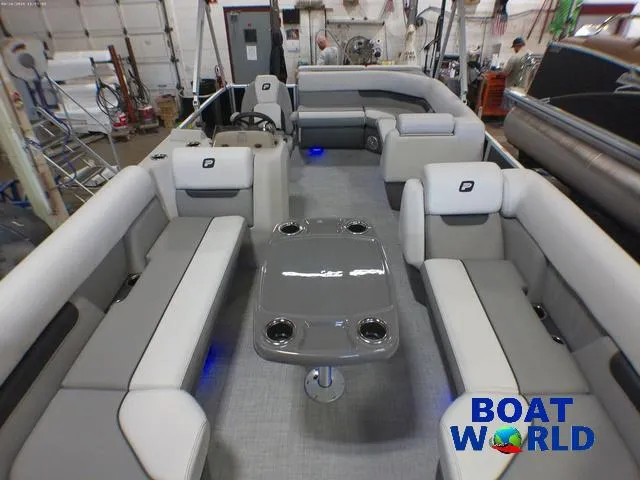 Slide: The Image of 2025 Princecraft Vectra 21 Cruise Lounge interior with seating and table, showcased at Boat World. - 7