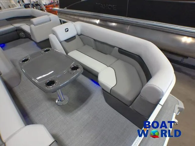 Slide: The Image of 2025 Princecraft Vectra 21 Cruise Lounge interior with gray seating and table, showcased at Boat World. - 9