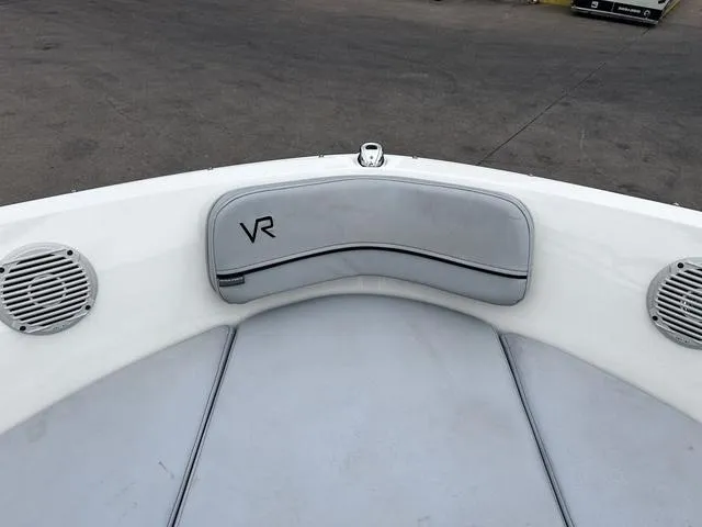 Slide: The Image of 2021 Bayliner VR6 Bowrider boat interior with gray seating and speakers. - 12