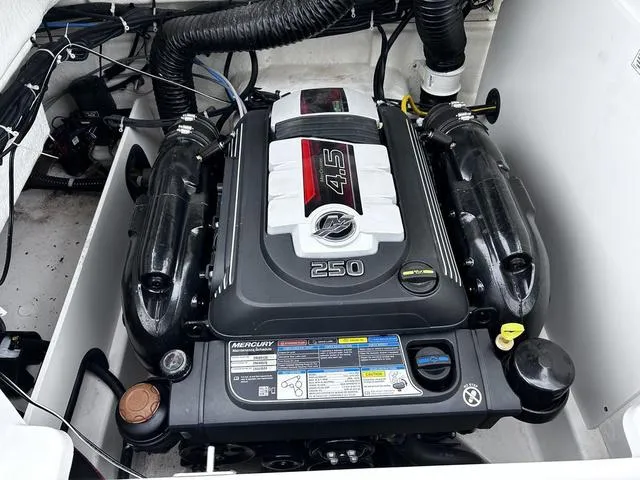 Slide: The Image of 2021 Bayliner VR6 Bowrider engine compartment with Mercury 4.5L 250 HP engine. - 16