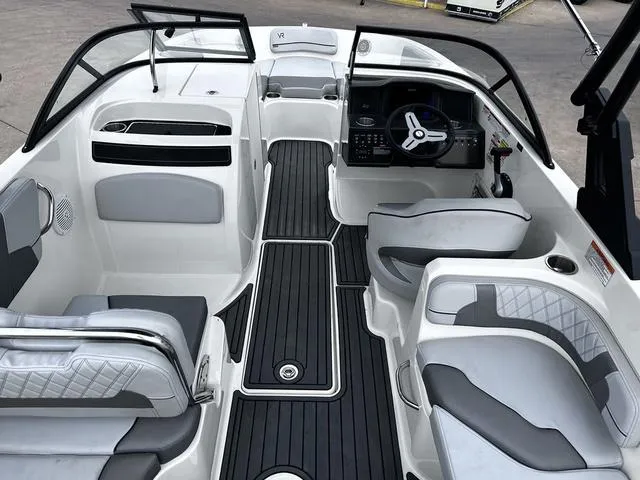 Slide: The Image of 2021 Bayliner VR6 Bowrider interior with sleek seating and modern dashboard design. - 8