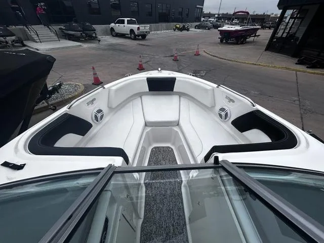 Slide: The Image of 2018 Chaparral 21 H2O Sport I/O boat interior with seating and speakers. - 12