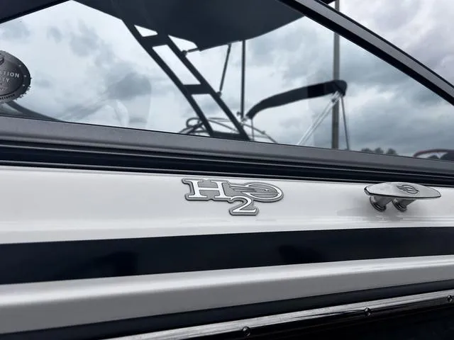 Slide: The Image of 2018 Chaparral 21 H2O Sport I/O boat with sleek design and chrome detailing. - 4