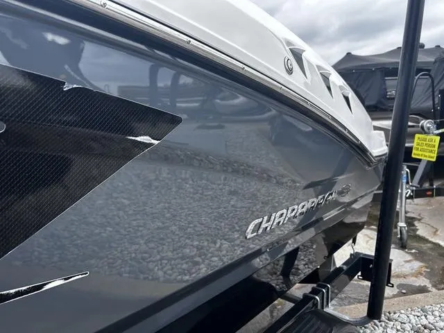 Slide: The Image of 2018 Chaparral 21 H2O Sport I/O boat, sleek design, glossy finish, on trailer. - 5