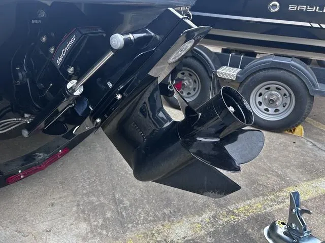 Slide: The Image of 2018 Chaparral 21 H2O Sport I/O boat with MerCruiser outdrive, trailer in background. - 8