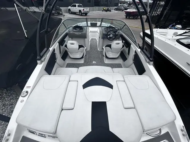 Slide: The Image of 2018 Chaparral 21 H2O Sport I/O boat interior with seating and steering wheel. - 9