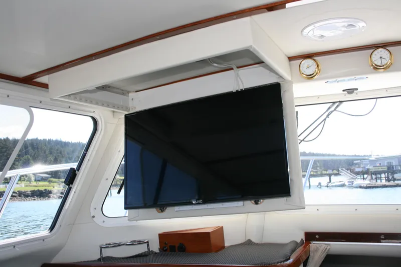 Slide: The Image of Interior of 2011 Ocean Sport Roamer 30' with mounted TV and scenic window view. - 10
