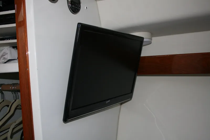 Slide: The Image of Flat-screen TV mounted inside 2011 Ocean Sport Roamer 30' boat cabin. - 14