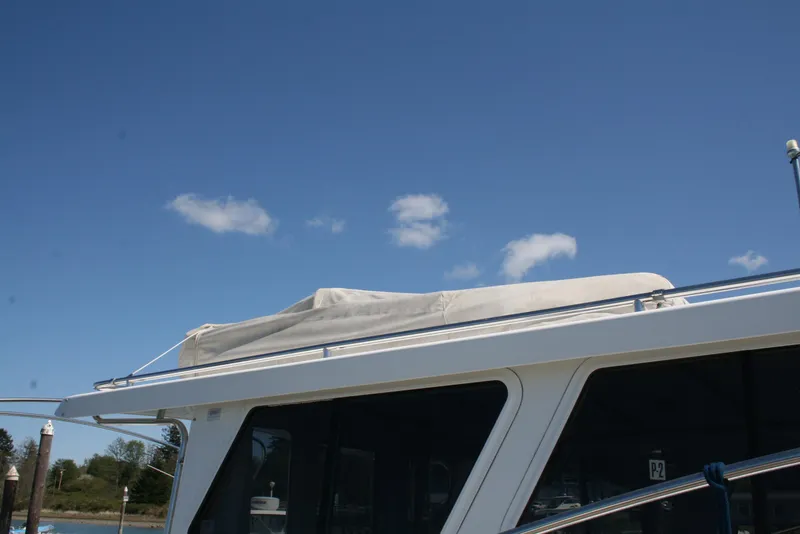 Slide: The Image of Ocean Sport Roamer 30' 2011 boat roof against clear blue sky. - 22
