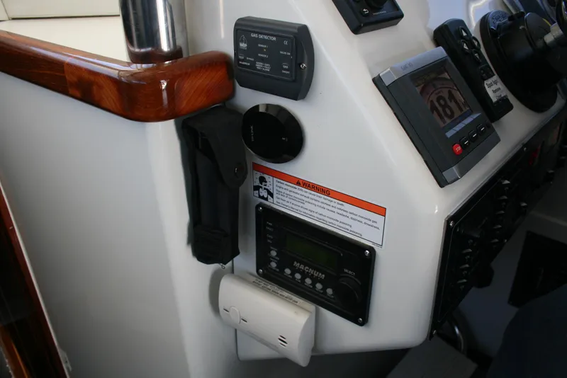 Slide: The Image of Control panel of a 2011 Ocean Sport Roamer 30' boat with navigation instruments. - 6