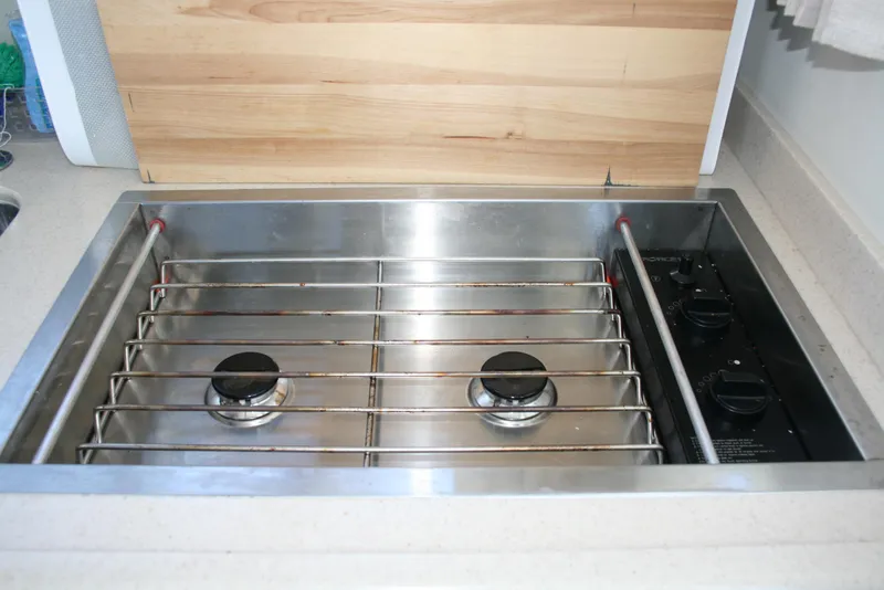 Slide: The Image of Stainless steel stove in 2011 Ocean Sport Roamer 30' boat kitchen. - 8