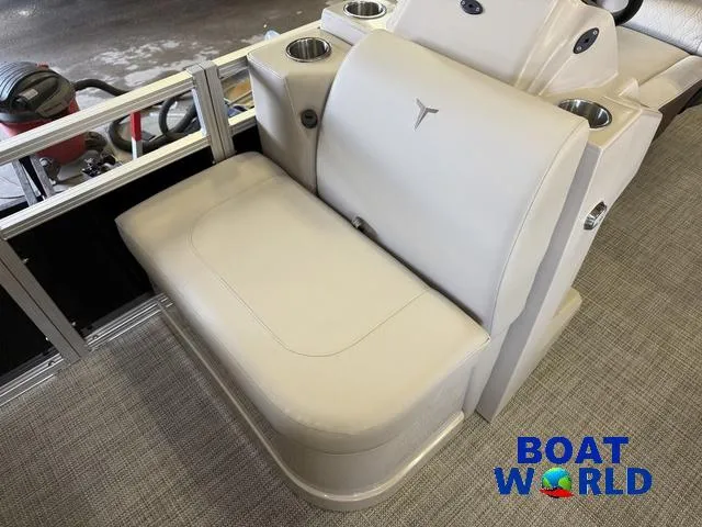 Slide: The Image of 2025 Tahoe Sport 2185 Quad Fish boat seat with cup holders, showcased at Boat World. - 11