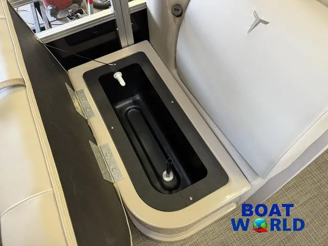 Slide: The Image of 2025 Tahoe Sport 2185 Quad Fish boat seat storage compartment, featuring Boat World logo. - 12