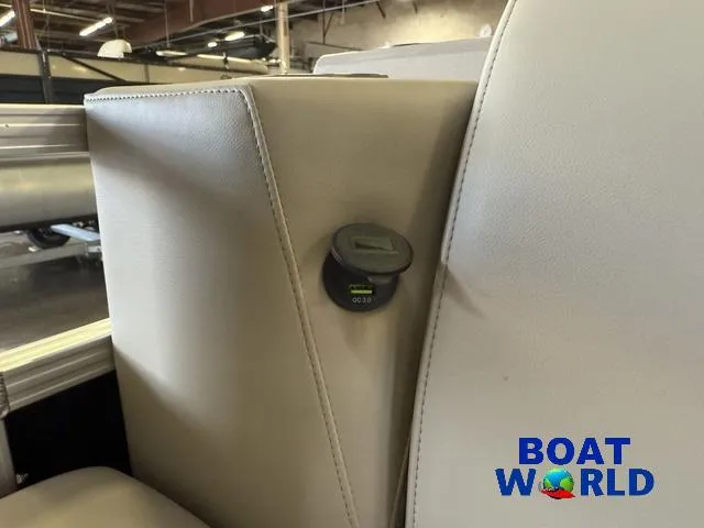 Slide: The Image of 2025 Tahoe Sport 2185 Quad Fish interior with charging port, showcased at Boat World. - 13