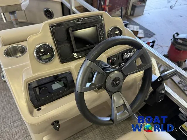 Slide: The Image of Steering console of 2025 Tahoe Sport 2185 Quad Fish boat with modern controls and display. - 17