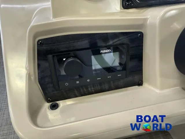 Slide: The Image of 2025 Tahoe Sport 2185 Quad Fish boat stereo system, featuring Fusion audio controls. - 18