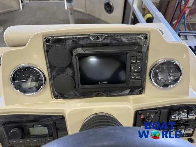 Slide: The Image of Dashboard of 2025 Tahoe Sport 2185 Quad Fish with Garmin display and controls. - 19