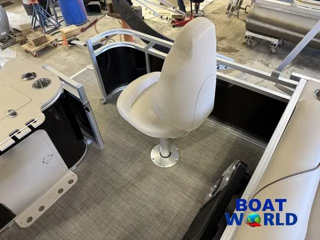 Slide: The Image of 2025 Tahoe Sport 2185 Quad Fish boat interior with seating, showcased at Boat World. - 22