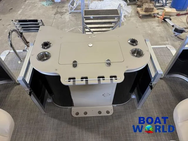 Slide: The Image of 2025 Tahoe Sport 2185 Quad Fish boat console with cup holders and storage. - 23