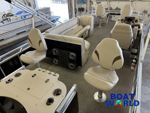 Slide: The Image of 2025 Tahoe Sport 2185 Quad Fish boat interior with seating and control panel. - 28