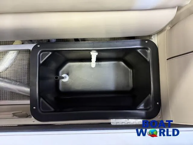 Slide: The Image of 2025 Tahoe Sport 2185 Quad Fish livewell, featuring durable black interior. - 30