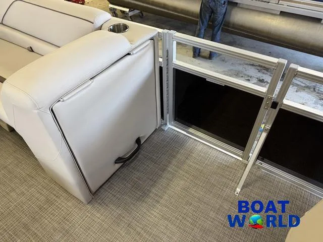 Slide: The Image of 2025 Tahoe Sport 2185 Quad Fish interior with seating and storage, featuring Boat World branding. - 31