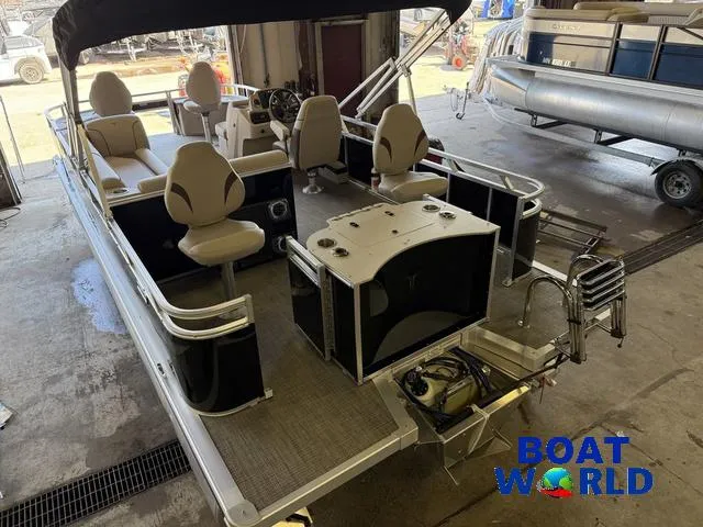 Slide: The Image of 2025 Tahoe Sport 2185 Quad Fish pontoon boat with Honda 4-Stroke EFI engine in a showroom. - 47