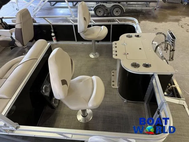 Slide: The Image of 2025 Tahoe Sport 2185 Quad Fish boat interior with seating and fishing station. - 5