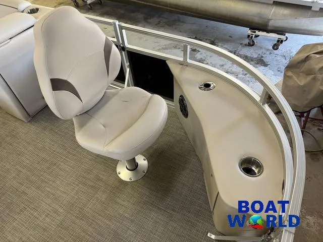Slide: The Image of 2025 Tahoe Sport 2185 Quad Fish boat interior with swivel seat and console. - 8