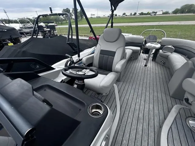 Slide: The Image of 2020 Lowe SS250 WS WindShield boat interior with gray seating and steering console. - 10