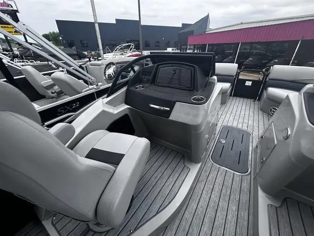 Slide: The Image of 2020 Lowe SS250 WS WindShield boat interior with modern seating and dashboard. - 16