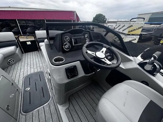 Slide: The Image of 2020 Lowe SS250 WS WindShield boat interior with steering wheel and dashboard controls. - 17