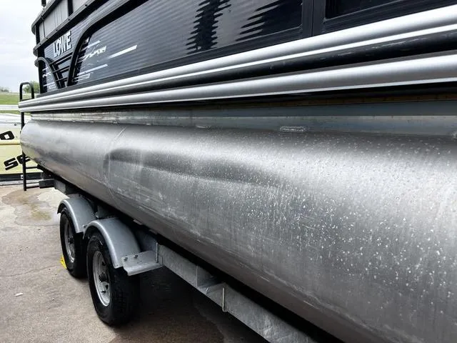 Slide: The Image of 2020 Lowe SS250 WS WindShield boat on trailer, side view, showing aluminum hull. - 3