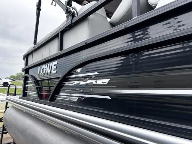 Slide: The Image of 2020 Lowe SS250 WS WindShield pontoon boat with sleek black exterior design. - 4