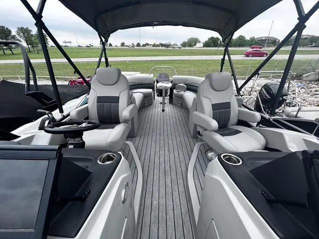 Slide: The Image of 2020 Lowe SS250 WS WindShield boat interior with gray seating and canopy. - 9