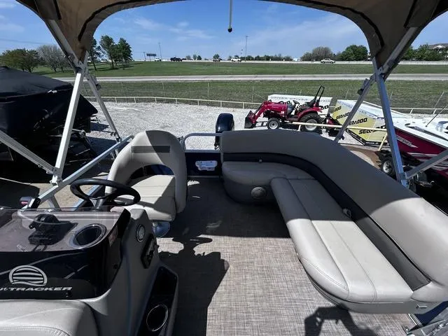 Slide: The Image of 2023 Sun Tracker Bass Buggy® 16 XL Select pontoon boat interior with seating and steering console. - 10