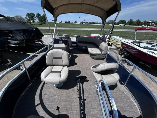 Slide: The Image of 2023 Sun Tracker Bass Buggy® 16 XL Select pontoon boat with spacious seating and canopy. - 8