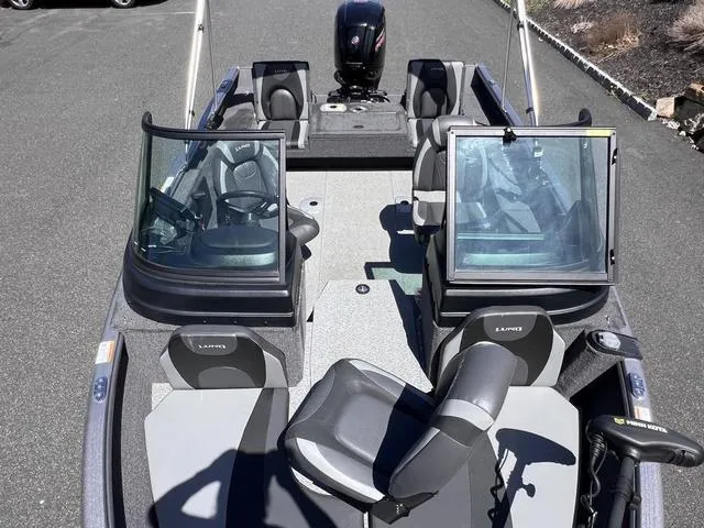 Slide: The Image of 2023 Lund 1775 Impact XS Sport boat interior with seating and windshield. - 13