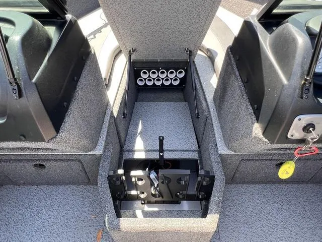 Slide: The Image of 2023 Lund 1775 Impact XS Sport boat interior with open storage compartment. - 4