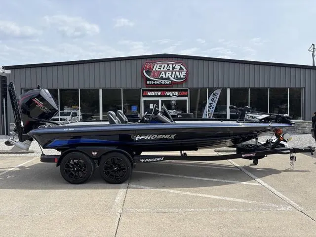 Slide: The Image of 2025 Phoenix 920 Elite boat parked at Wieda's Marine dealership. - 1