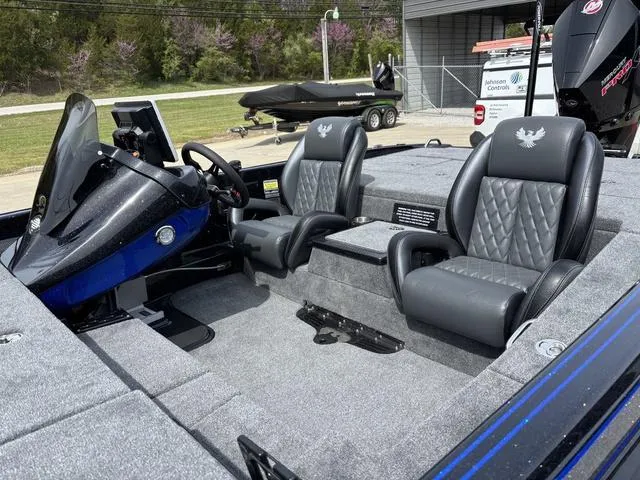 Slide: The Image of 2025 Phoenix 920 Elite boat interior with dual seats and modern dashboard. - 10