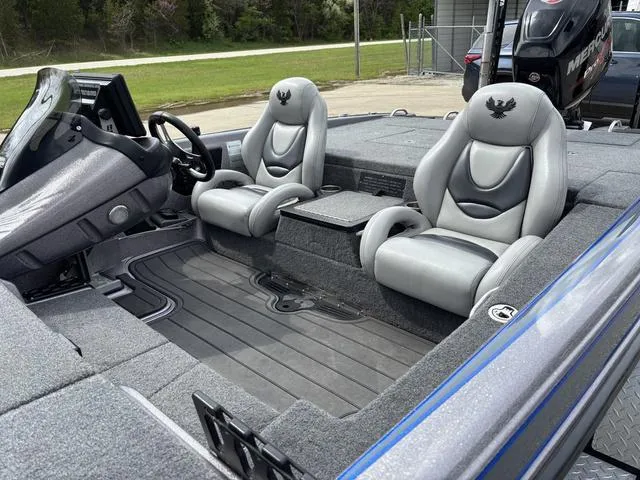 Slide: The Image of 2015 Phoenix 920 PRO XP boat interior with dual gray seats and steering console. - 12