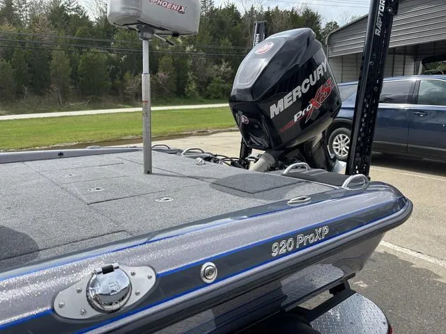 Slide: The Image of 2015 Phoenix 920 PRO XP boat with Mercury Pro XS engine, parked outdoors. - 13