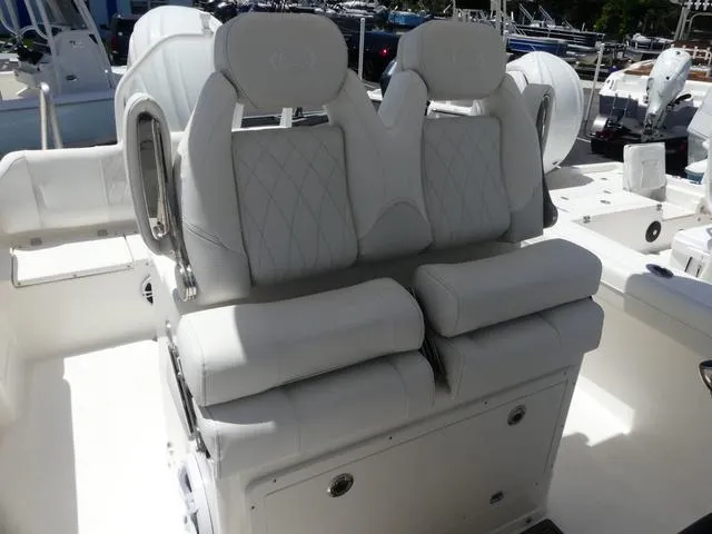 Slide: The Image of 2025 Key West 239 FSR boat with luxurious white seating and modern design. - 12