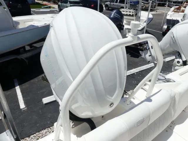 Slide: The Image of 2025 Key West 239 FSR boat engine detail in a marina setting. - 15