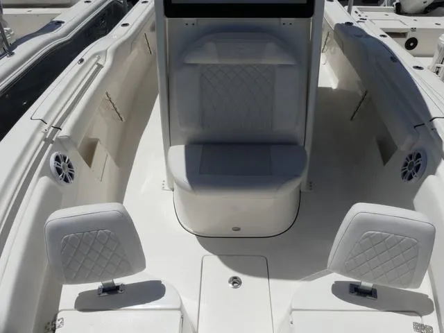 Slide: The Image of 2025 Key West 239 FSR boat interior with white seating and modern design. - 17